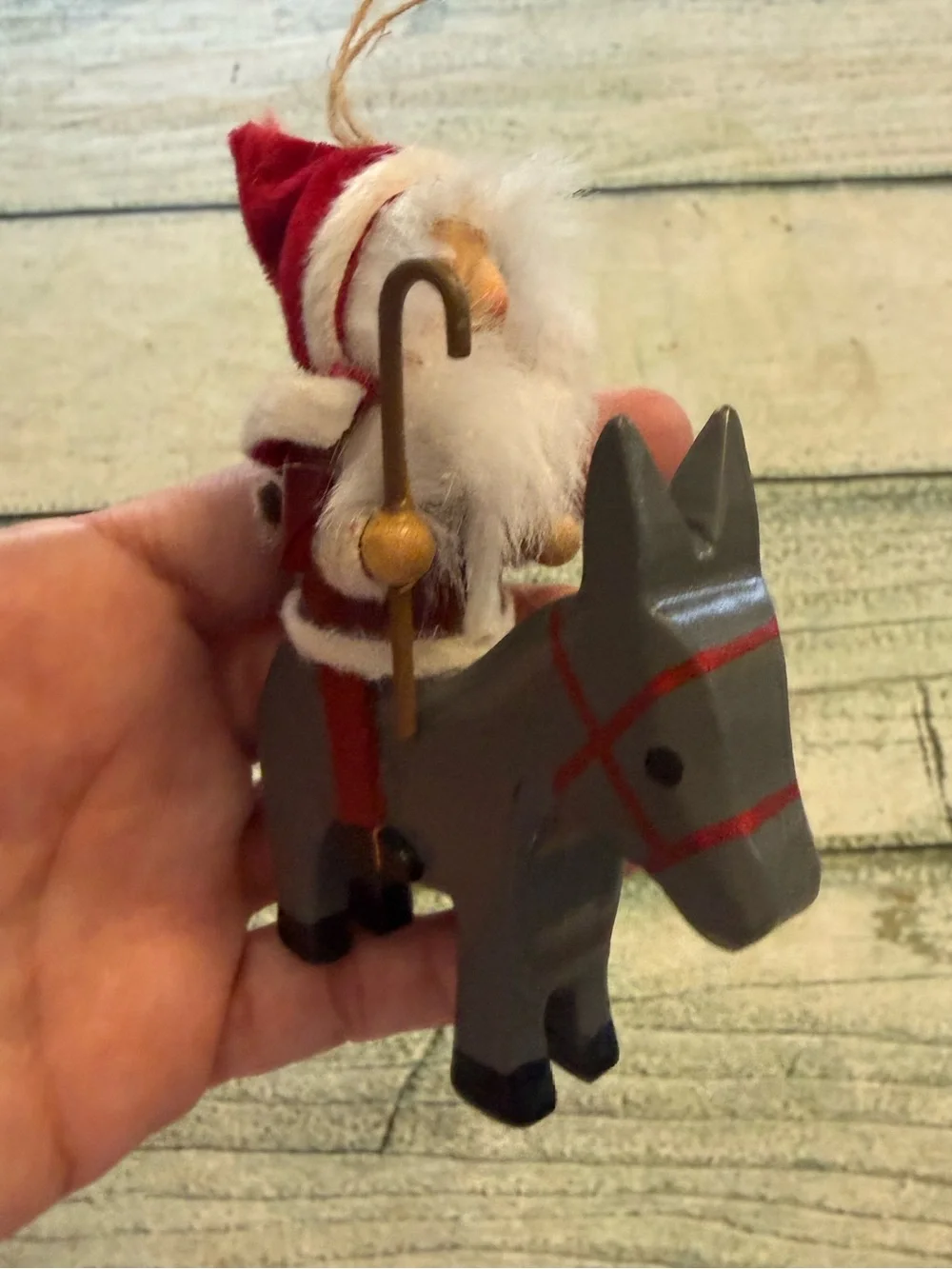 Vintage Christmas wood Santa riding a donkey horse ornament.